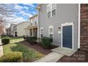 Inviting two-story townhome with well-maintained landscaping and a welcoming entrance at 128 Locomotive Ln # 110, Mooresville, NC 28115