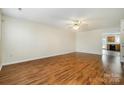 Inviting living room with hardwood floors and neutral walls, ready for your personal touch at 128 Locomotive Ln # 110, Mooresville, NC 28115