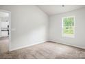 Bright bedroom with neutral carpet and natural light from the window at 1550 Doran Ter, Richburg, SC 29729