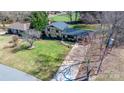 Expansive aerial view of a home with a large front yard and mature trees at 2530 31St Street Ne Dr, Hickory, NC 28601