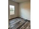 Bedroom featuring vinyl floors, a window and neutral paint at 3258 Killian Rd, Lincolnton, NC 28092