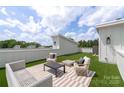 Stylish rooftop patio featuring comfortable seating and serene green surroundings at 3413 Holabird Ln # 10, Charlotte, NC 28208