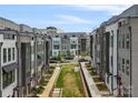 Modern townhome community features well-maintained green spaces and sidewalks for a pedestrian-friendly environment at 5003 Tiny Ln, Charlotte, NC 28203