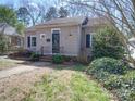 Charming single Gathering home with landscaped front yard, bushes, walkway, and front door at 507 6Th W Ave, Gastonia, NC 28052