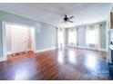 Bright living room with hardwood floors, fireplace, and ample natural light from windows at 507 6Th W Ave, Gastonia, NC 28052