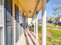 Inviting front porch with classic white columns, offers a shaded and relaxing outdoor space at 5414 Peachwood Dr, Charlotte, NC 28216