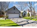 View of a house with two car garage and lush green lawn on a beautiful day at 9200 Four Acre Ct, Charlotte, NC 28210