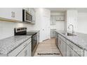 Modern kitchen featuring granite countertops, stainless steel appliances, and ample cabinet space at 1032 Hostler Ln, York, SC 29745