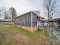 Side view of a camper with a screened porch and wooden accents, blending indoor and outdoor living at 171 Holly Harbor Trl # B62, Mount Gilead, NC 27306