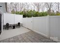 Private patio with white fence offering an ideal space for outdoor relaxation at 1915 Colony Line Ct, Charlotte, NC 28210