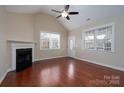 Bright living room featuring hardwood floors, fireplace, and natural light at 2227 Cashmere Ct, Denver, NC 28037