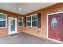 View of the brick covered patio with ceiling fan at 2227 Cashmere Ct, Denver, NC 28037
