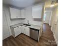 Bright kitchen boasts granite countertops, stainless steel dishwasher, ample cabinet space, and wood-look flooring at 2766 Stagbuck Dr, Gastonia, NC 28052