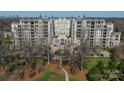 An aerial shot capturing the condo building's grand scale and meticulously landscaped surroundings at 2823 Providence Rd # 236, Charlotte, NC 28211