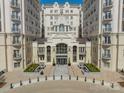 Grand condo entrance with beautiful landscaping and manicured gardens with cobblestone entryway at 2823 Providence Rd # 236, Charlotte, NC 28211