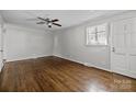 Bright bedroom features hardwood floors, neutral paint, ceiling fan and natural light at 3120 Minnesota Rd, Charlotte, NC 28208