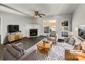 Cozy living room featuring a fireplace, neutral furniture, and a door to outdoor patio at 3212 Irwin Valley Ct, Charlotte, NC 28269