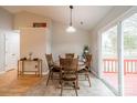 Cozy dining room featuring a wood table with deck access through sliding glass doors at 3414 Clearview Dr, Monroe, NC 28110