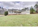 Traditional home with a well-maintained lawn and covered front porch at 4205 Ore Bank Dr, Lincolnton, NC 28092