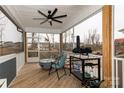 Covered porch features a ceiling fan and an outdoor dining set for entertaining at 615 R L Stowe Rd, Belmont, NC 28012