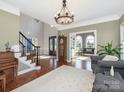 Grand foyer with high ceilings, hardwood floors, and an elegant staircase, showcasing a welcoming atmosphere at 620 Briar Patch Ter, Waxhaw, NC 28173