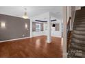 Bright and airy living room with hardwood floors, decorative columns, and an open floor plan at 649 Shellbark Dr, Concord, NC 28025