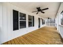 Expansive porch showcasing wood floors, white columns, and multiple ceiling fans at 801 Sandifer Rd, York, SC 29745