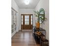 Bright foyer with hardwood floors, stylish mirror and modern console table at 820 Bellegray Rd, Clover, SC 29710