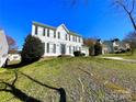 Traditional-style home with a well-manicured lawn, offering great curb appeal and a welcoming atmosphere at 9146 Austin Ridge Ln, Charlotte, NC 28214