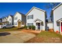 Street view of a row of homes featuring tidy landscaping, symmetrical facades, and inviting curb appeal at 1008 Beaugard Dr, Charlotte, NC 28208