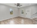 Bright living room with hardwood floors, and natural light from windows at 102 S Liberty St, Gastonia, NC 28052