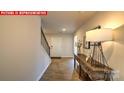 Inviting entryway features wood-look floors and a console table that leads to the staircase at 107 Windstone Common Ln, Mooresville, NC 28117