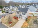 Aerial view of a cozy two-story home with attached garage nestled in a well-planned neighborhood at 1301 Waylon Ave, Gastonia, NC 28054