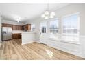 Open dining area adjacent to the kitchen, featuring lots of natural light and modern finishes at 136 Ridge Bluff Rd, Mooresville, NC 28115