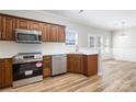 Modern kitchen with stainless steel appliances, ample cabinet space, and sleek countertops at 136 Ridge Bluff Rd, Mooresville, NC 28115