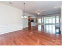 Open concept living space with hardwood floors that connects to kitchen and dining areas at 14309 Stonewater Ct, Fort Mill, SC 29707