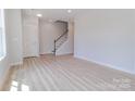 Bright, open-concept living space with beautiful flooring and natural light at 210 Gilead Rd, Huntersville, NC 28078