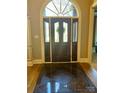 Welcoming entryway with decorative front door, tiled floor, and sidelight windows at 2379 Metcalf Dr, Sherrills Ford, NC 28673