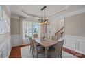 Bright dining room with natural light, modern chandelier, and stylish decor at 114 Runningdeer Dr, Mooresville, NC 28117