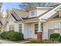 Inviting entrance of a townhome with a covered porch and manicured lawn at 1509 Tiana Way, Rock Hill, SC 29732