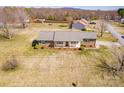 Sprawling ranch home on a large lot with a front porch, mature trees and mountain views at 19 Harolds Ct, Taylorsville, NC 28681