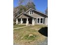 Charming home featuring a welcoming front porch with classic architectural details at 222 2Nd Ave, Albemarle, NC 28001