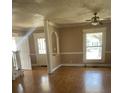 Inviting living room features hardwood floors, neutral paint, and abundant natural light at 222 2Nd Ave, Albemarle, NC 28001