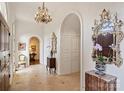 Elegant foyer with decorative mirrors, a chandelier, and arched entryways that provide depth and character at 318 S Canterbury Rd, Charlotte, NC 28211