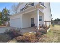 Inviting front porch with charming seating and manicured landscaping at 345 Corinth Church Rd, Mooresville, NC 28115