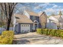 Attractive home exterior with a well-maintained lawn, driveway, tidy landscaping, and attached garage at 3601 Rosedown Dr, Matthews, NC 28105