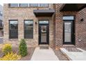 Inviting entryway featuring a black front door, modern awning, and well-manicured landscaping at 3750 Ellington St, Charlotte, NC 28211