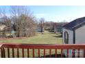 Wide backyard view from deck showcasing the lawn and surrounding landscape at 410 Cole Campbell Rd, Taylorsville, NC 28681