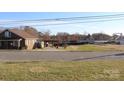 View of the property with a covered carport and spacious grassy area at 410 Cole Campbell Rd, Taylorsville, NC 28681