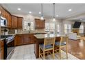 Well-equipped kitchen with a center island, stainless steel appliances, and stylish barstool seating at 4119 Flint Dr, Lancaster, SC 29720